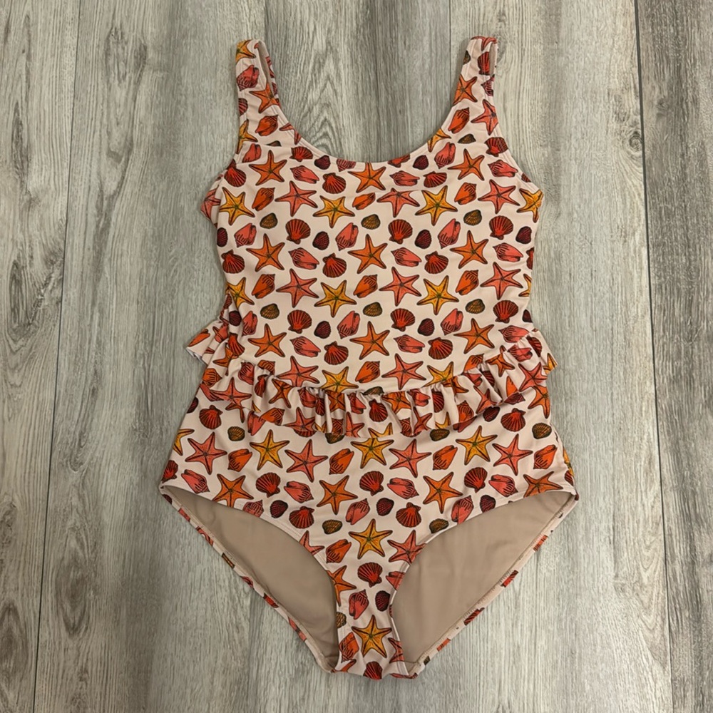 Kortni Jeane large skirted seashell one piece bathing suit